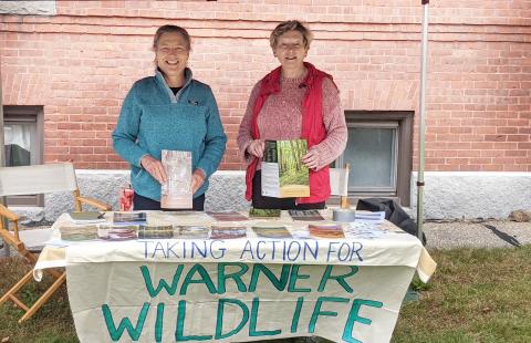 Members of the Warner cohort group table at a farmer's market